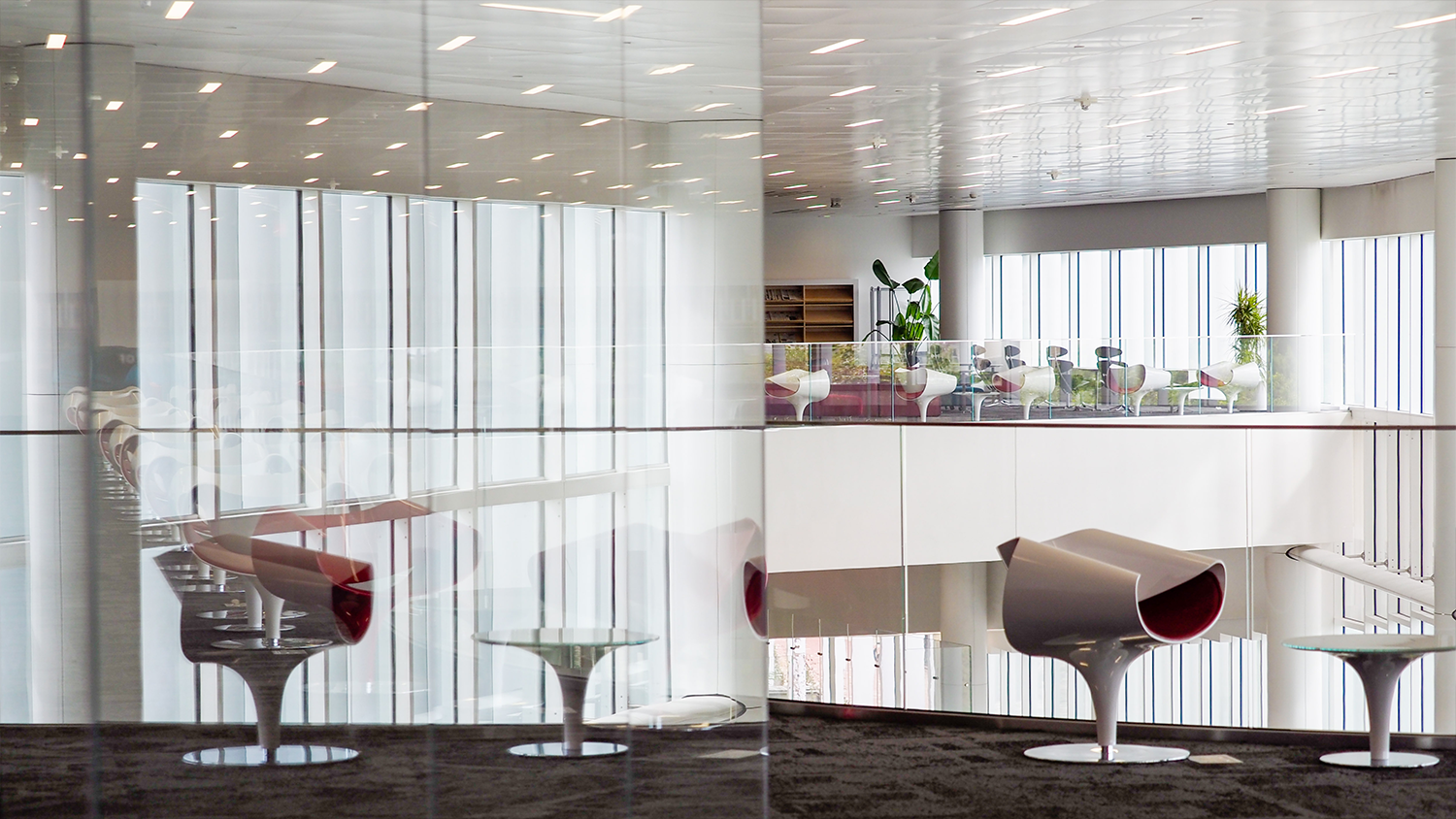 Reflections of chairs inside of Hunt Library.