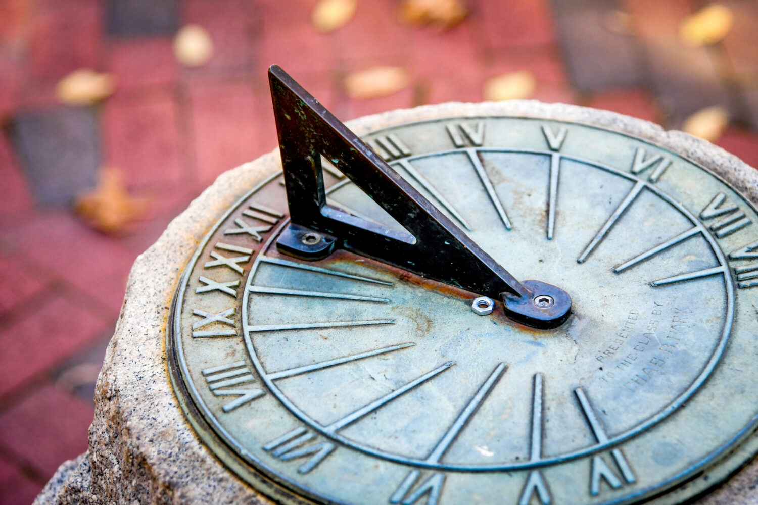 Fall leaves scatter around the sundial outside Primrose Hall on main campus. Photo by Becky Kirkland.