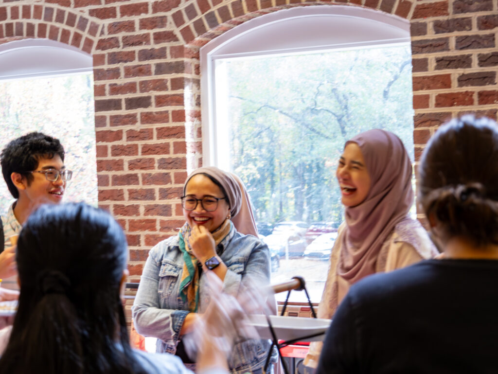 A group of students host an Indonesian table at the Global Tea and Coffee event for International Education Week