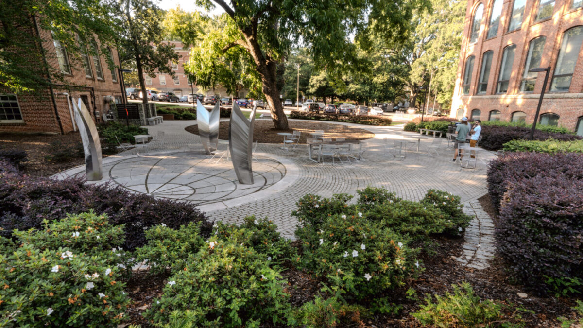 An image of the Global Courtyard, surrounded by plants and Primrose Hall
