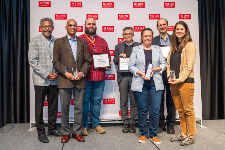 An image of award recipients posing with their awards.