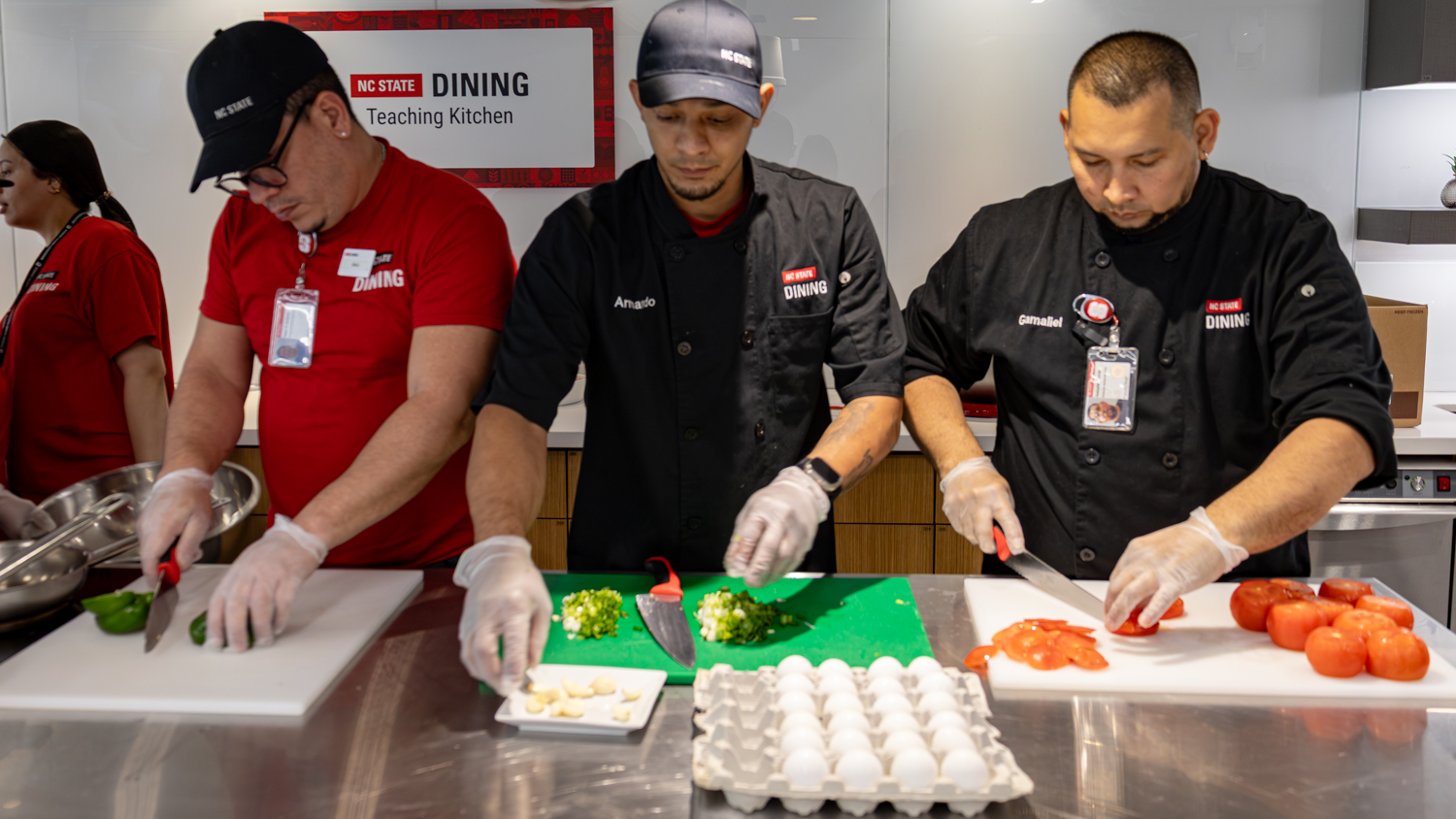 Students use kitchen knives to chop, slice, and dice ingredients.
