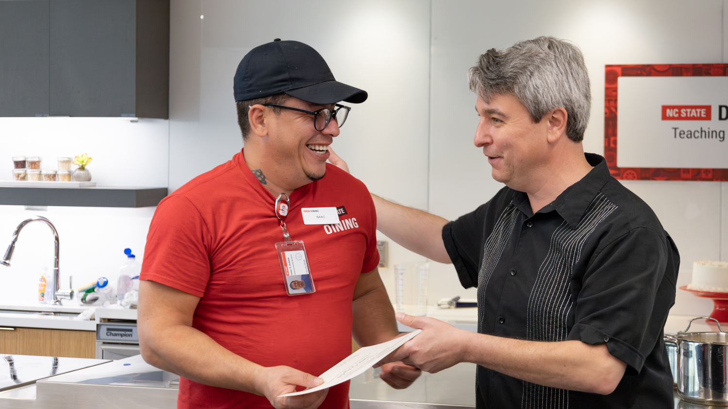 One of the students receives their final certificate for completion of the program.