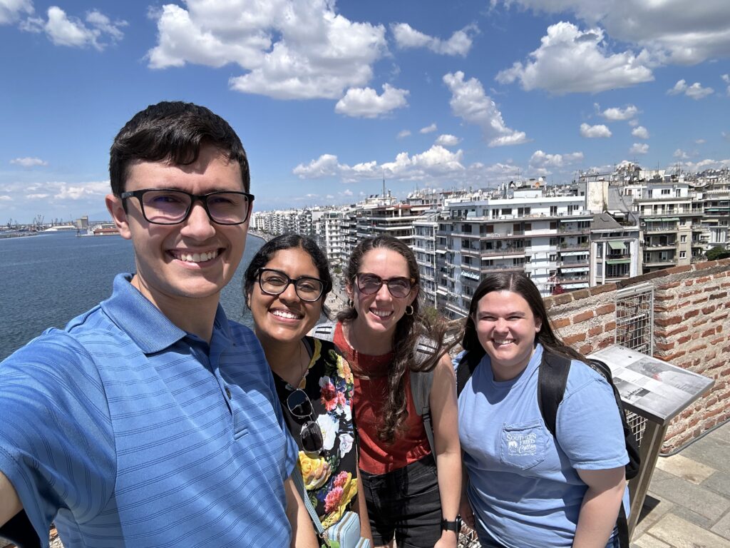 Lance Williams poses with friends while exploring Greece. 