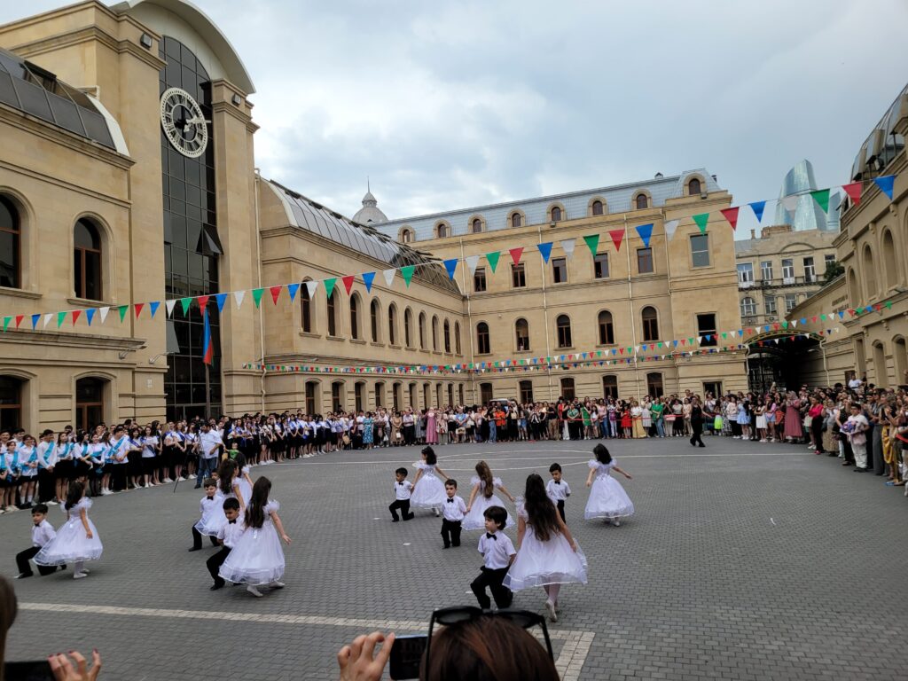 School kids and parents gather for a graduation ceremony on the last day of class in Azerbaijan (2023).