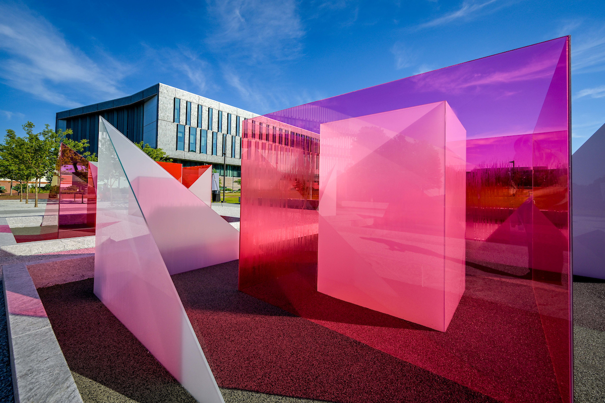 The Reds and Whites installation by artist Larry Bell stands as a welcoming beacon at the newly dedicated Susan Woodson Plaza, just outside the James B. Hunt Jr. Library on Centennial Campus. Photo by Becky Kirkland