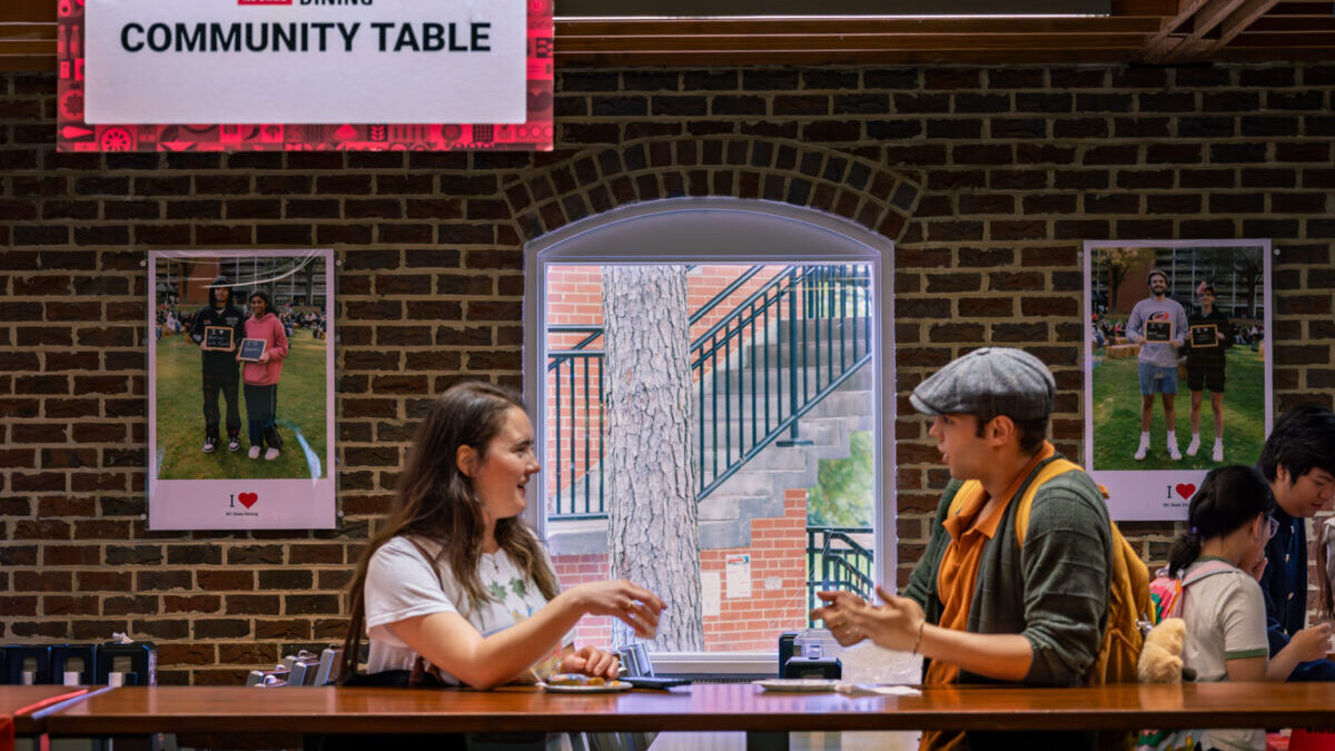 Two students facing each other having a conversation
