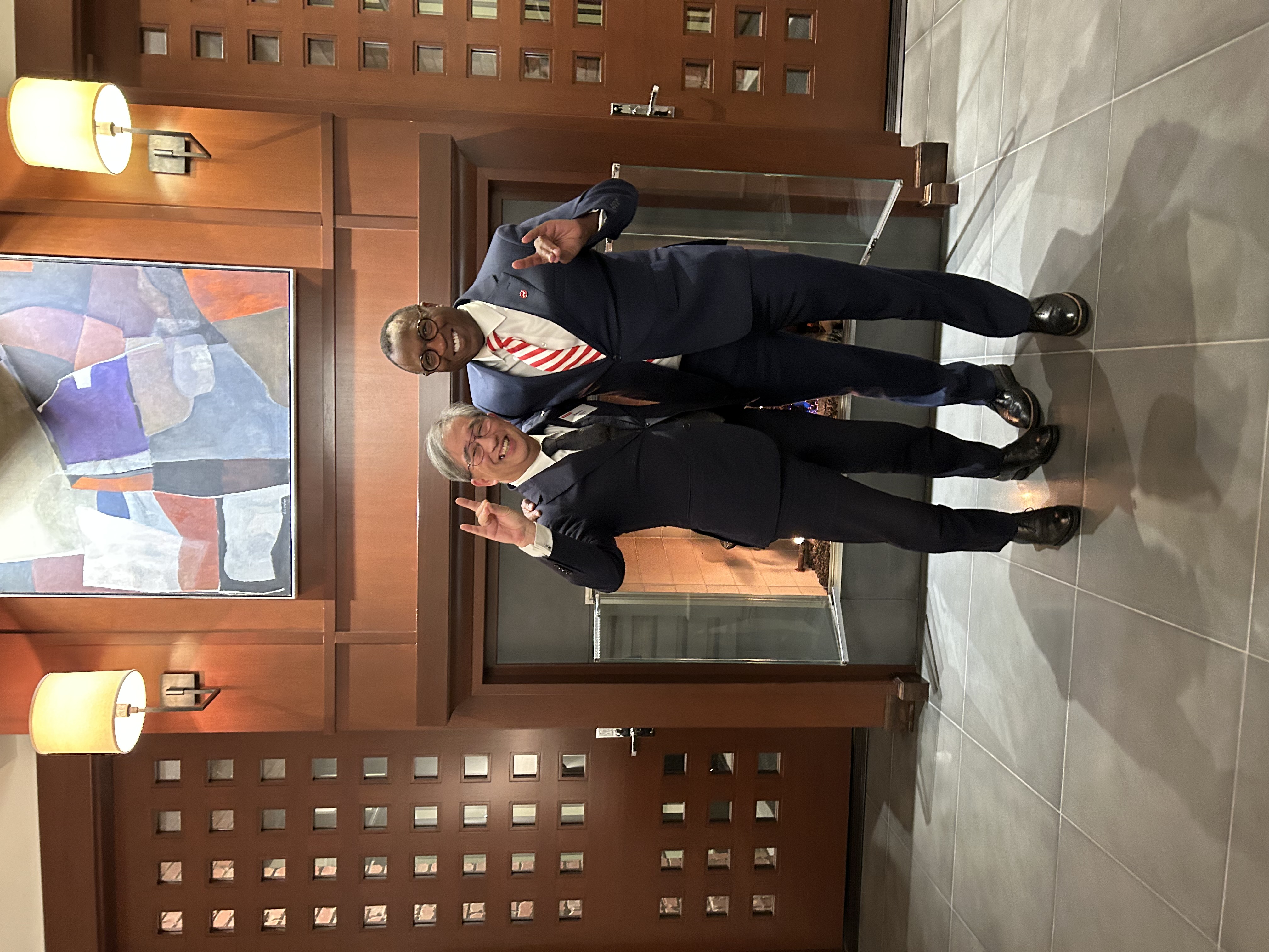 Chancellor Howell and President Sugiyama giving Wolfies at the Point