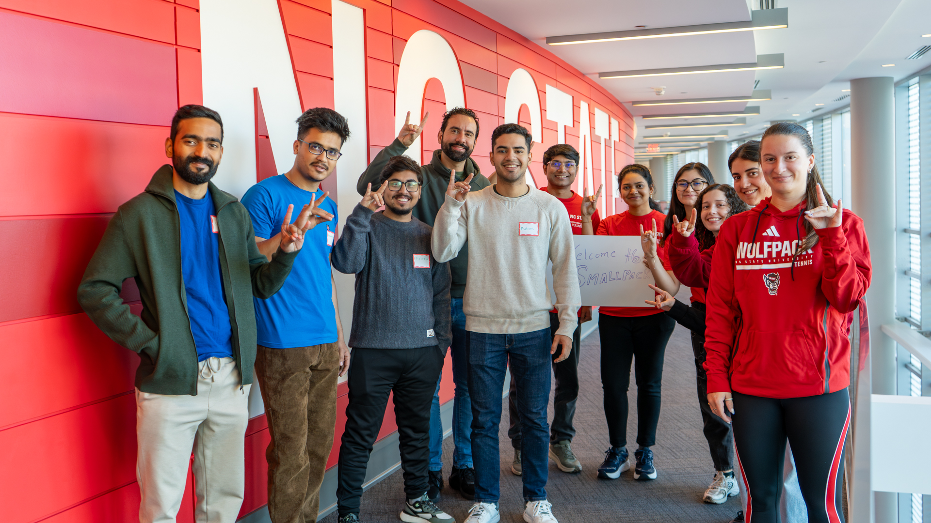 International students at NC State show off their Wolfies during orientation at Talley Student Union