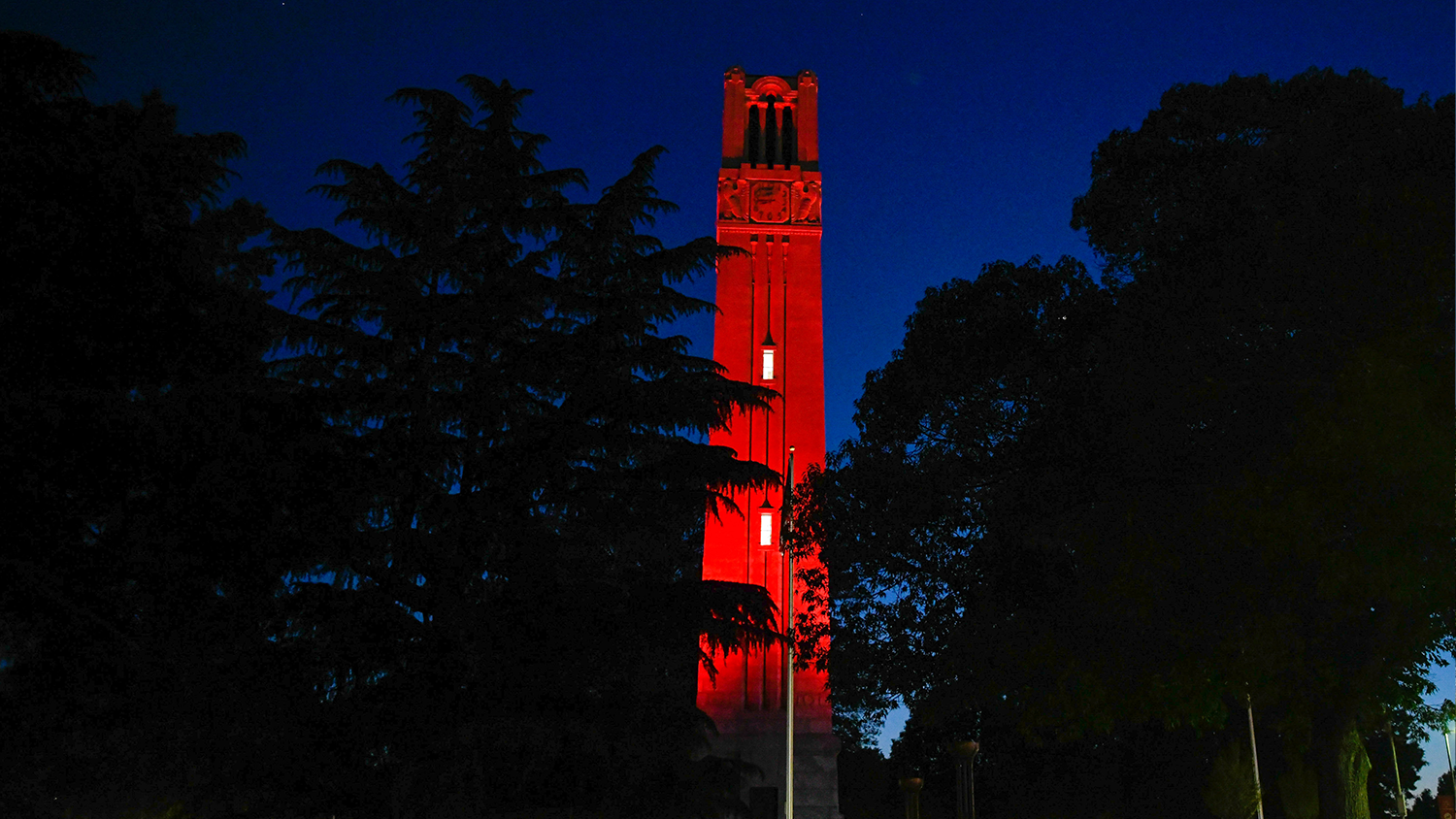 The belltower is light in red at night.