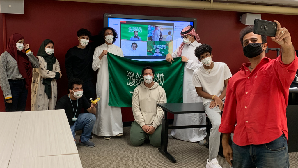 A group of students form Saudi Arabia are taking a selfie.