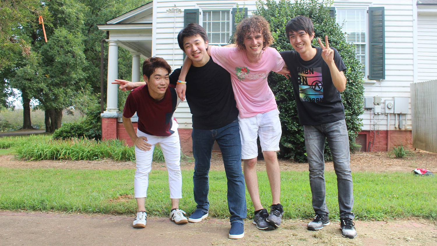 A group of male Japanese students posing for a group photo.