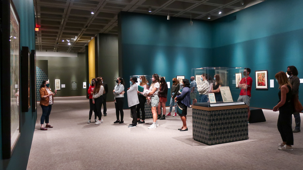 A group of students looking at the MUCHA art exhibition inside of the North Carolina Museum of Art, October 19.